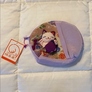 Girl’s small strapless kitty/bell purse